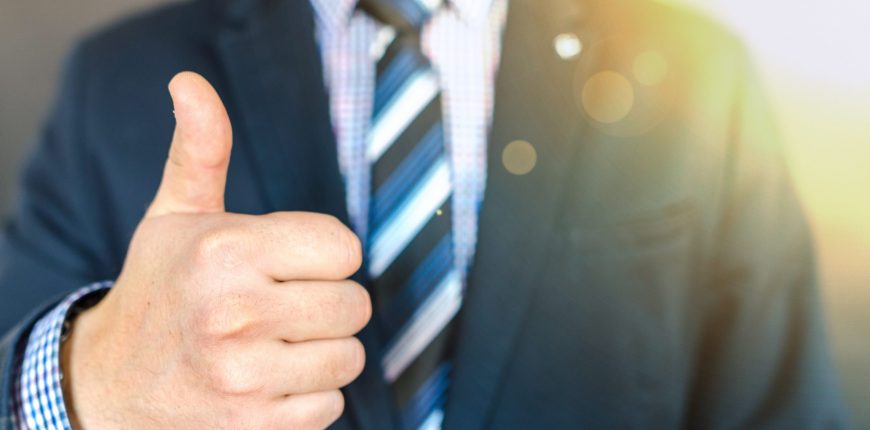 close-up-photo-of-man-wearing-black-suit-jacket-doing-thumbs-684385